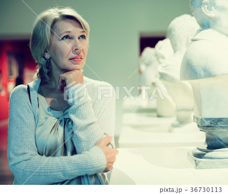 Portrait of woman visitor near sculpture Portrait of woman visitor near sculpture 36730113