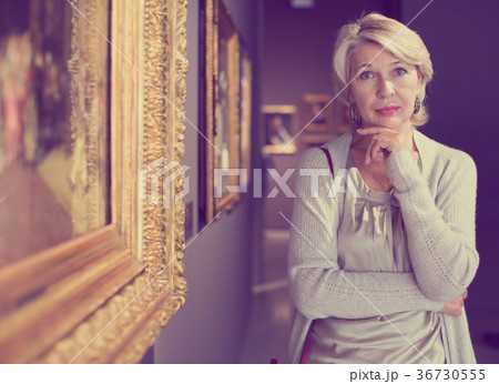 woman in art museum near the painting woman in art museum near the painting 36730555