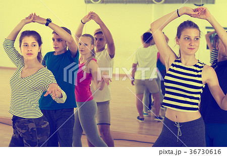 Pair of teenagers studying of partner dance 36730616