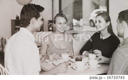 group of four friends enjoying coffee at pastry bar group of four friends enjoying coffee at pastry bar 36730783