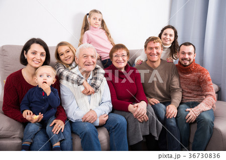 Friendly large family making numerous photos 36730836