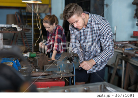 Master is standing near vise equipment 36731091