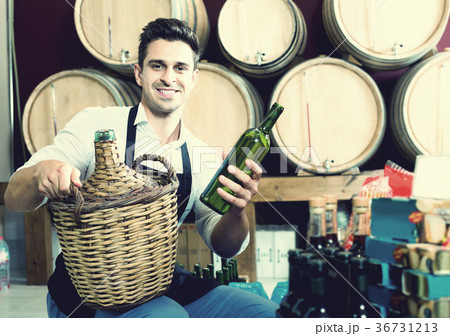 Man seller in wine shop 36731213
