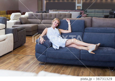Girl is testing new furniture Girl is testing new furniture 36731329