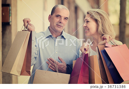 Aged couple with purchases Aged couple with purchases 36731386