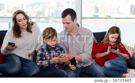 Family plaing with mobile phones Family plaing with mobile phones 36731465