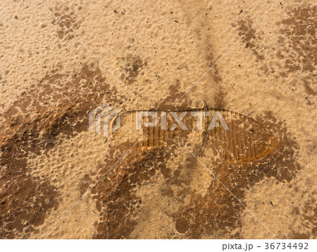 Human boot footprint on the sand. Concept mark in 36734492