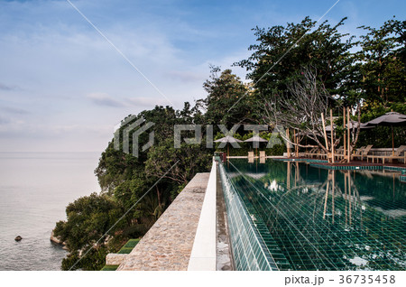 Infinity edge pool on cliff with ocean view  36735458