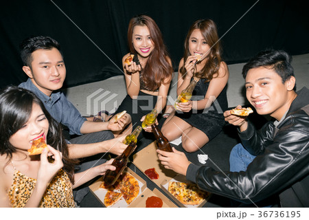 Having drinks and pizza with friends Having drinks and pizza with friends 36736195