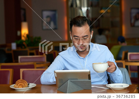 Drinking coffee and reading news 36736285