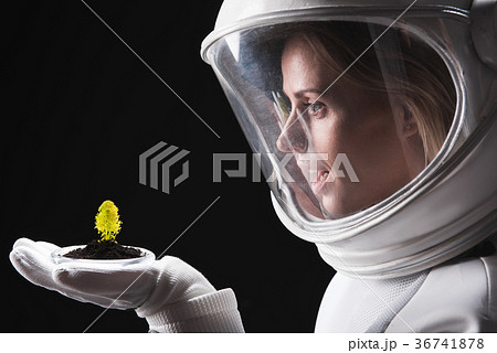 Surprised spacewoman is discovering other organism 36741878