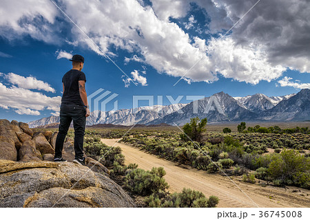 Young person in Alabama Hills in Sierra Nevada Young person in Alabama Hills in Sierra Nevada 36745008