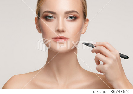 Beautiful young woman before plastic surgery 36748670