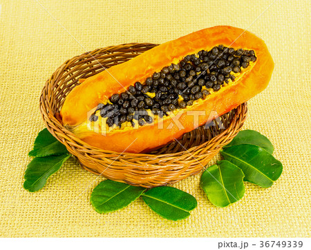 half yellow fruit ripe papaya with black round 36749339