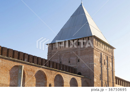 brick old tower with a pointed roof part of wall brick old tower with a pointed roof part of wall 36750695