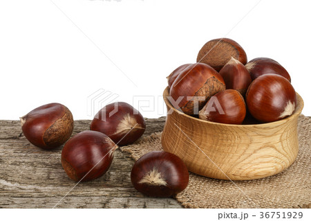 chestnut in bowl on the old wooden table with 36751929