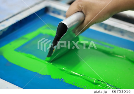 Hand pressing silk-screen printing, close up view. Hand pressing silk-screen printing, close up view. 36753016
