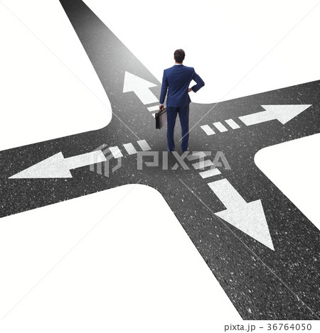 Young businessman at crossroads in uncertainty Young businessman at crossroads in uncertainty 36764050