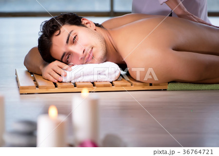 Young handsome man during spa procedure 36764721