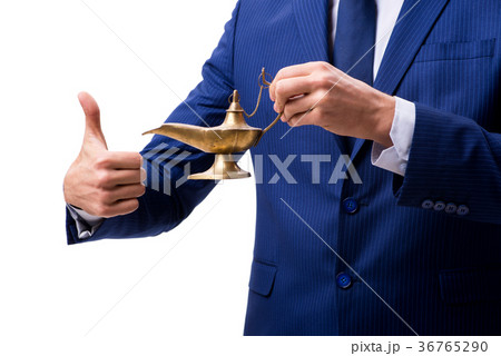 Businessman with magic lamp isolated on white 36765290