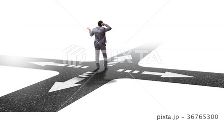 Young businessman at crossroads in uncertainty 36765300