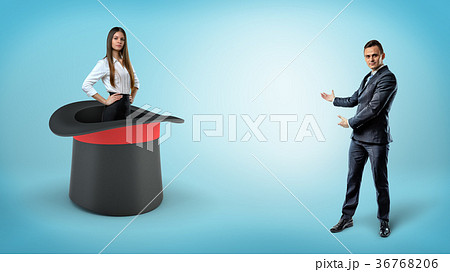 A businessman shows a self-assured businesswoman A businessman shows a self-assured businesswoman 36768206