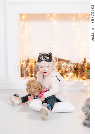 portrait beautiful little girl near the fireplace 36773232