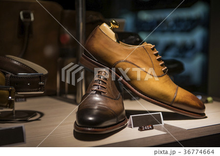 Men shoes in a luxury store in Paris. Men shoes in a luxury store in Paris. 36774664