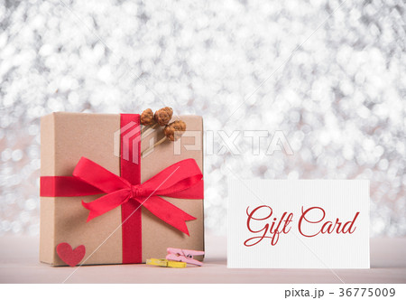 gift box with red ribbon and message gift card 36775009