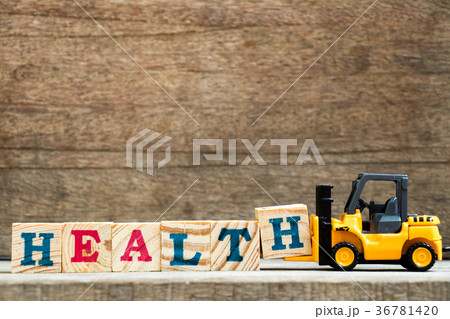 Yellow toy forklift hold letter H to word health 36781420