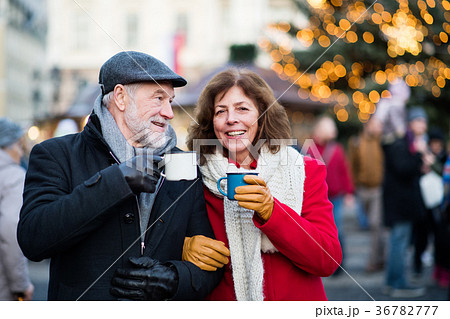 Senior couple on an outdoor Christmas market. 36782777
