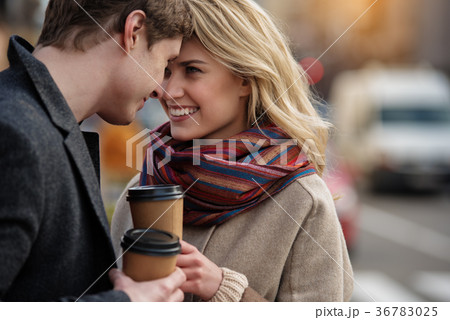 Pretty youthful couple warming up with tea Pretty youthful couple warming up with tea 36783025