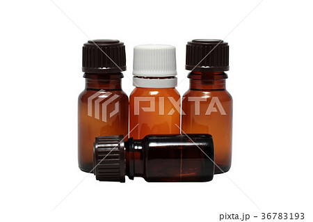 four bottles of aromatherapy oils isolated four bottles of aromatherapy oils isolated 36783193