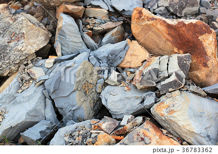 Cracks and colorful layers of sandstone background 36783362