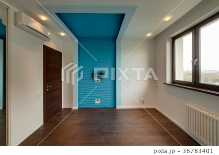 The room with a blue wall under the TV, with faste 36783401
