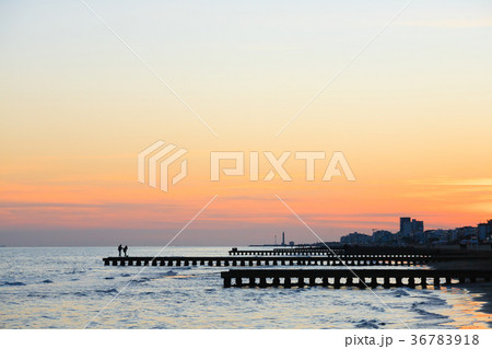 Beach at dawn, piers perspective view 36783918