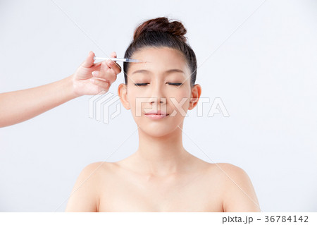 Beautiful woman on isolated White background 36784142