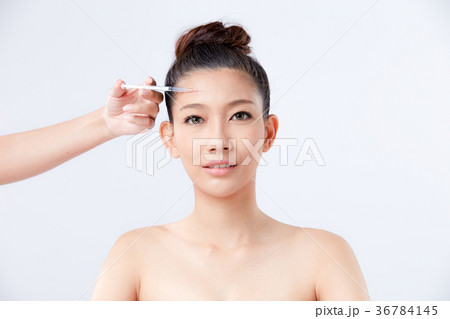 Beautiful woman on isolated White background 36784145