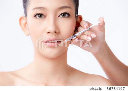 Beautiful woman on isolated White background 36784147