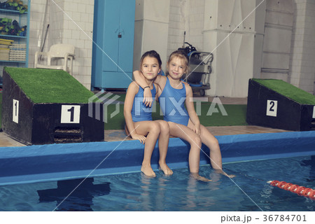 Two School Girls Sitting at a Pool Two School Girls Sitting at a Pool 36784701