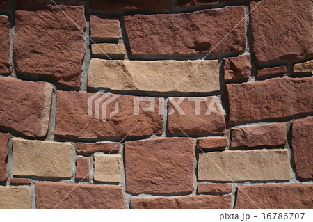 Wall of red stone texture background Wall of red stone texture background 36786707