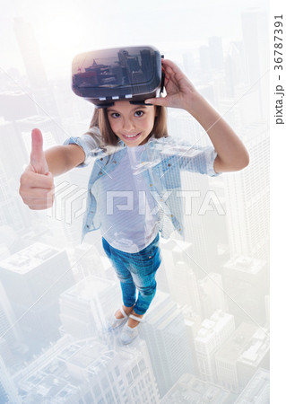 Top view of girl in VR headset showing thumbs up 36787391
