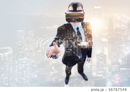 Young businessman wearing VR headset 36787549