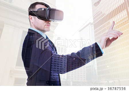 Handsome businessman pressing a button in VR Handsome businessman pressing a button in VR 36787556