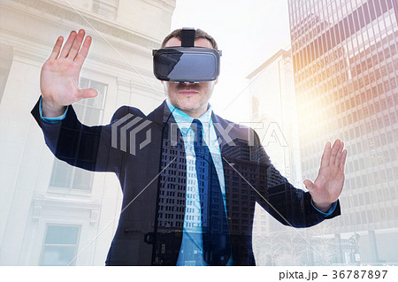 Bristled businessman experiencing virtual reality 36787897