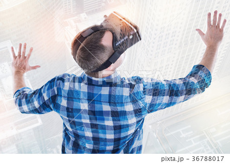 Top view of young man playing VR games Top view of young man playing VR games 36788017