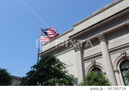 American flag and white building in New York 36789719