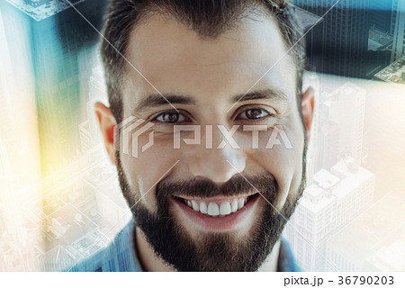 Pleasant joyful man looking straight and having Pleasant joyful man looking straight and having 36790203