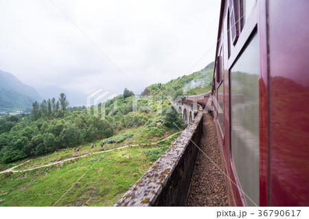 Jacobite Steam Train passing Glenfinnan Viaduct Jacobite Steam Train passing Glenfinnan Viaduct 36790617