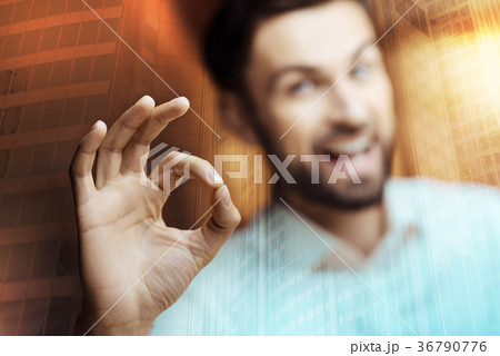 Smiling young man showing OK gesture 36790776